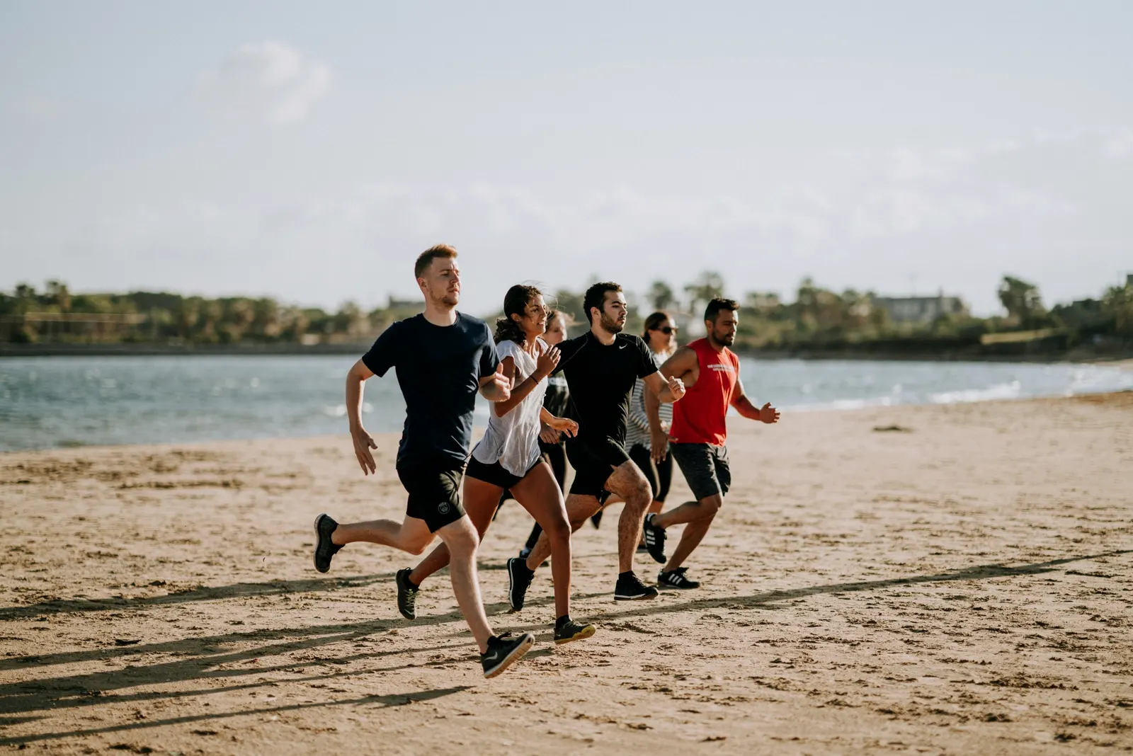 Adults running together outdoors, the kind of regular activity Dr. Roxanna Gangi, optometrist, discusses with patients concerned about eye health