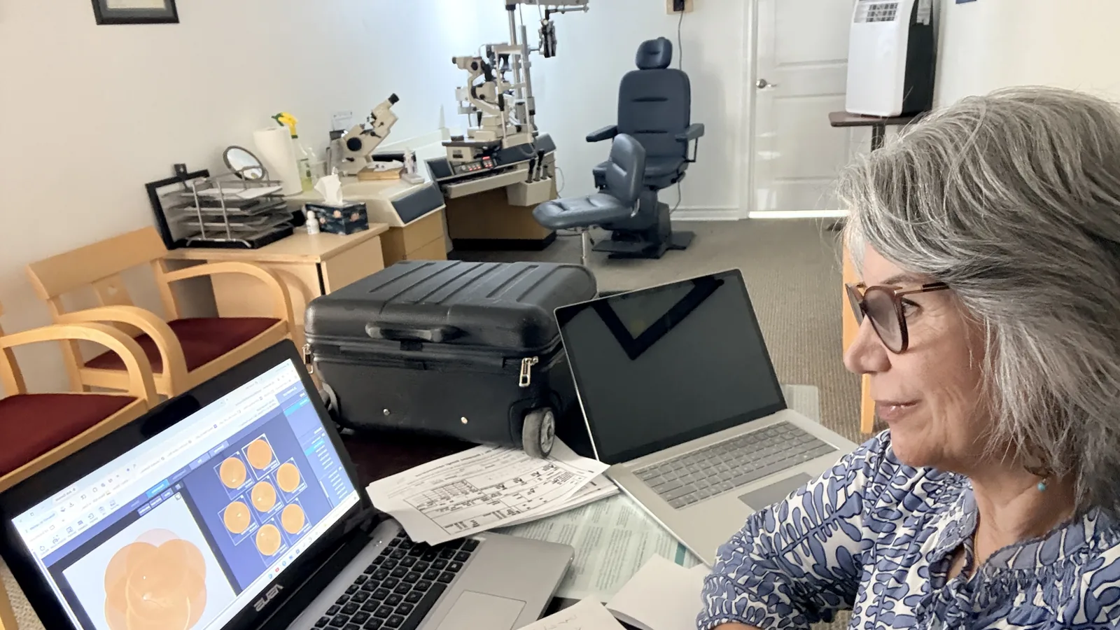 Dr. Roxanna Gangi reviewing retinal screening images for a patient with diabetes